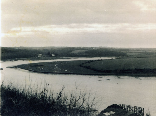Undated photograph of Hook standing on a sweep of the River Cleddau